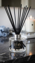 Roth Scention diffuser on a dark surface with a blurred background